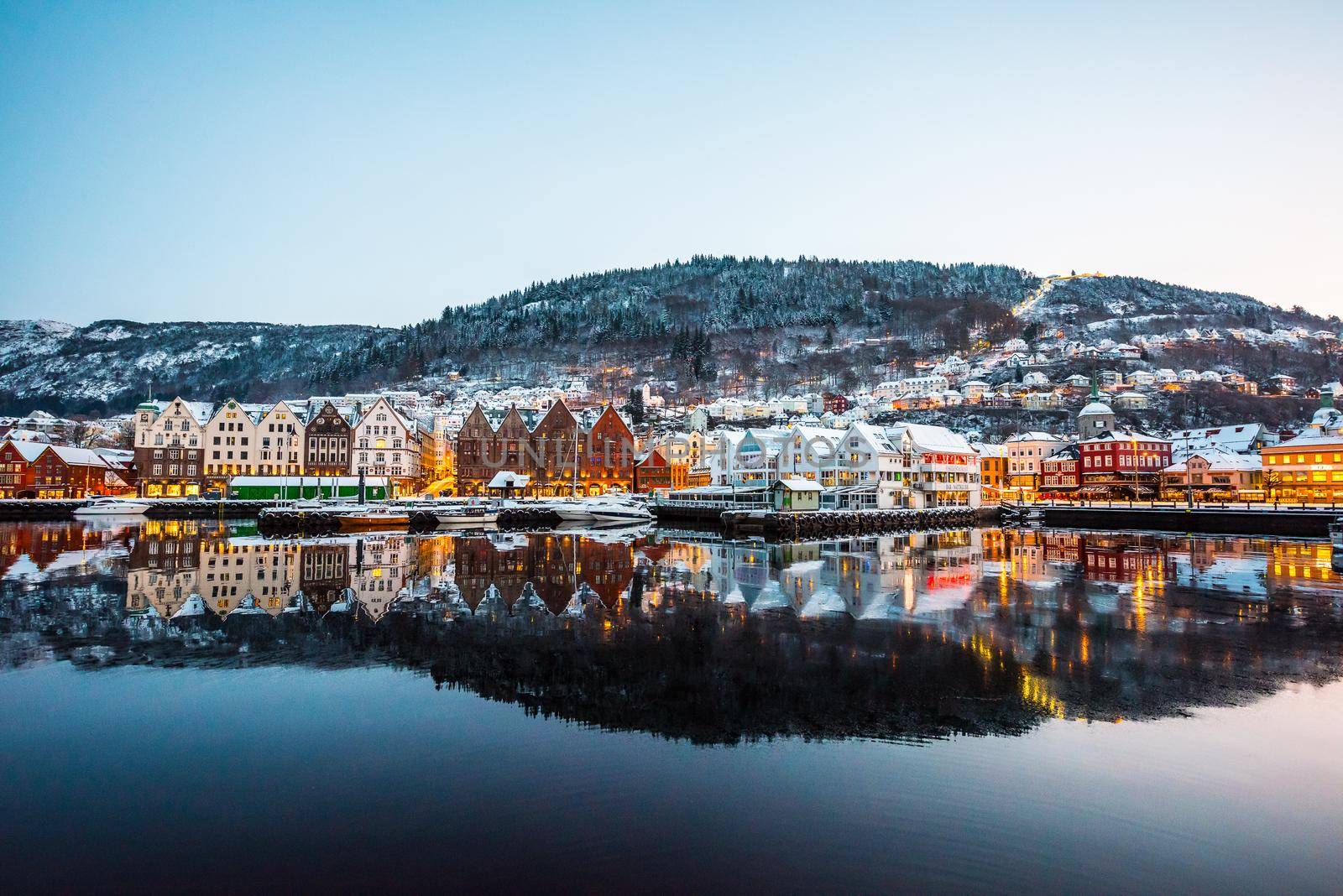 Bergen, Norway - December 27, 2014: Famous Bryggen street with wooden colored houses in Bergen at Christmas, Norway