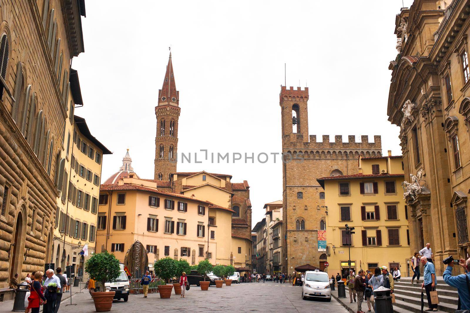 Florence, Italy, October 11, 2018: Piazza di San Firenze with Chiesa San Filippo Neri, Badia Fiorentina Monastero Catholic Church and Bargello Museum in the historic city center, Tuscany.