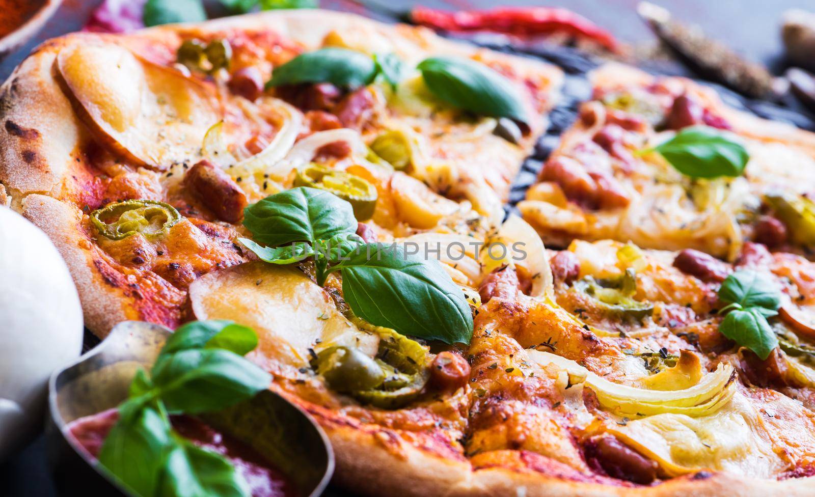 tasty pizza on a black background close up