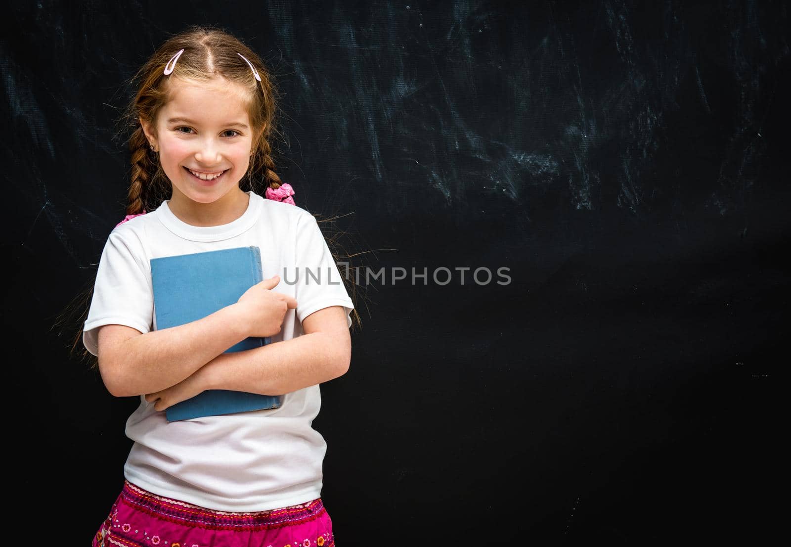 little girl on black school board background by GekaSkr