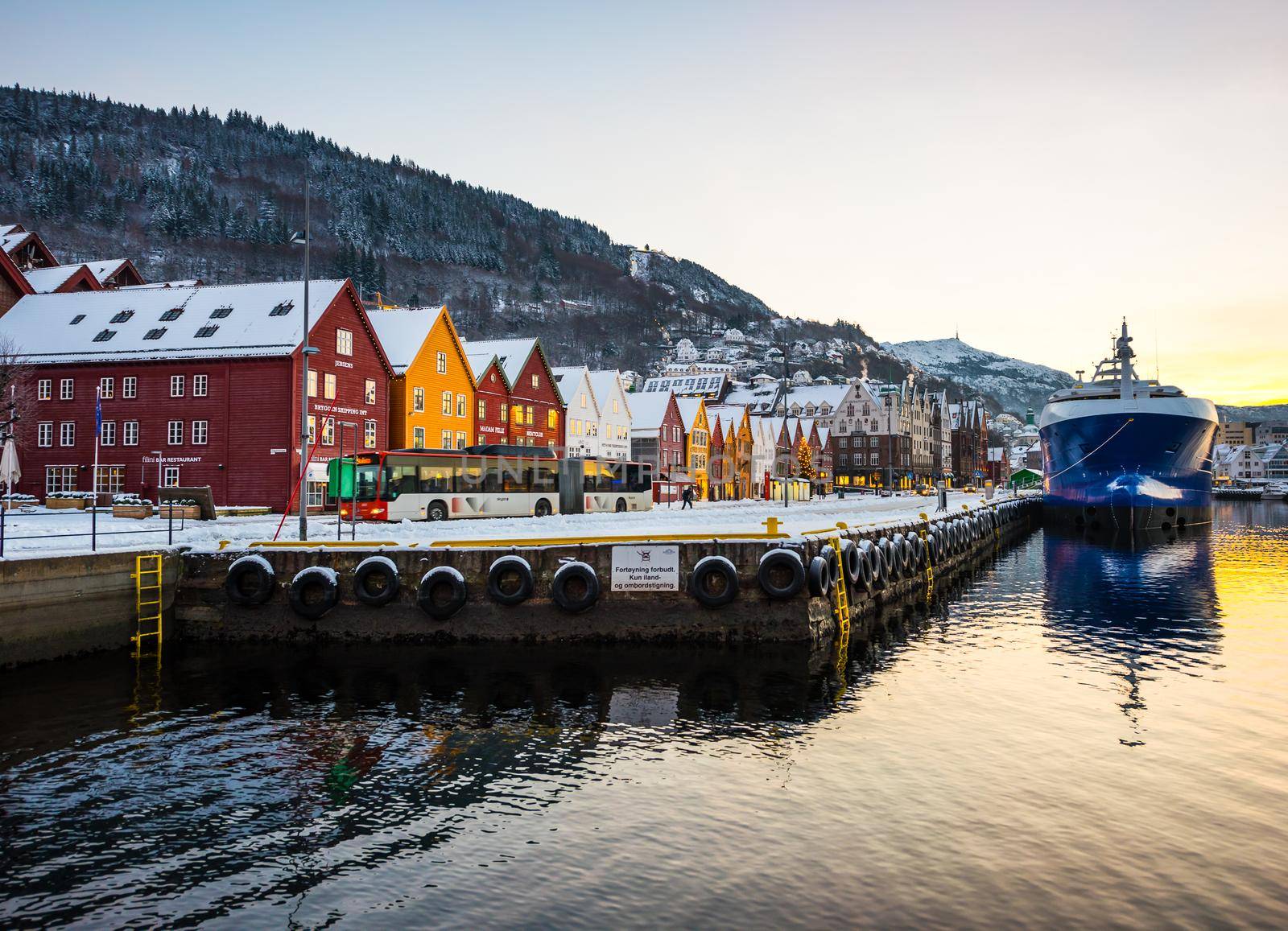 Bergen, Norway - December 27, 2014: Famous Bryggen street with wooden colored houses in Bergen at Christmas, Norway