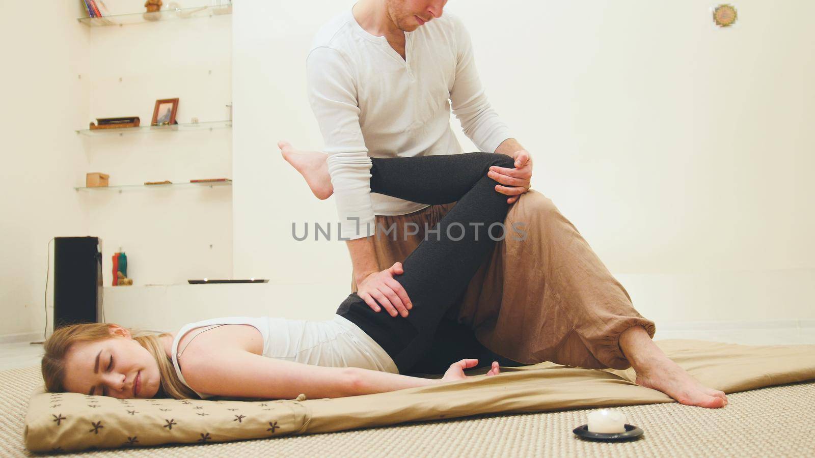 Thai traditional therapy for the spine and legs - shocking strong massage, horizontal