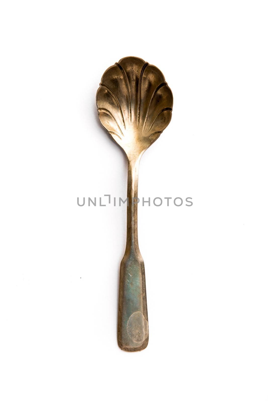 Old metal spoon isolated on a white background