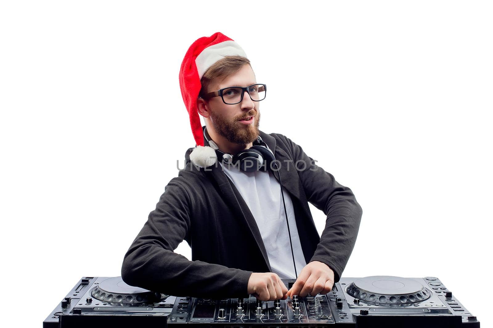 Funny Bearded man dj in christmas hat and glasses plays music on a turntable while isolated on white background. New Year party. Christmas party