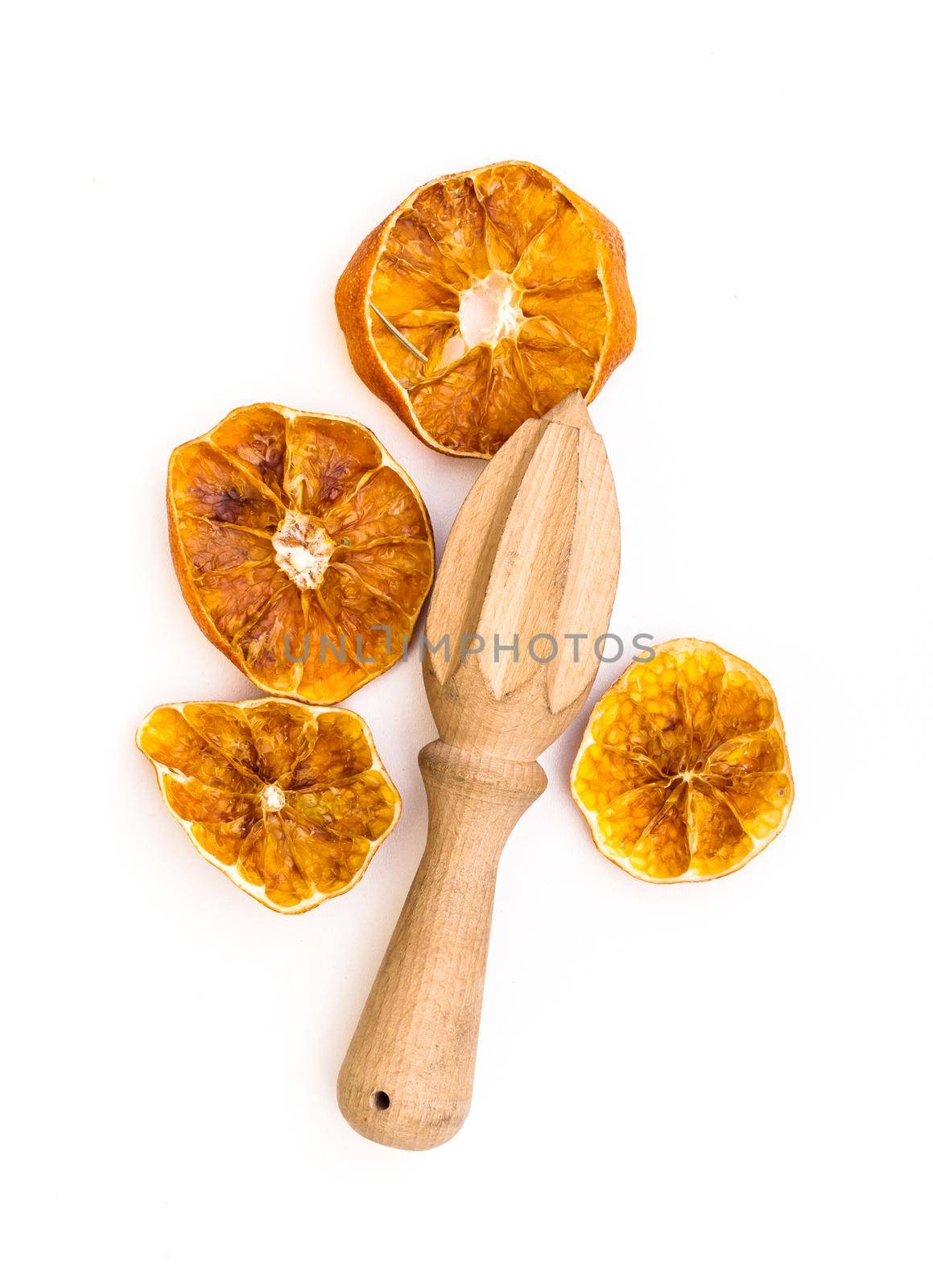 Dried lemon and whisk isolated on a white background