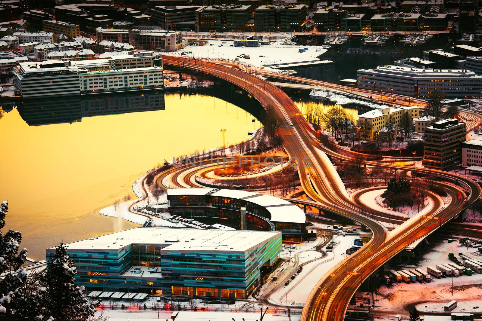 view from the mountains to Bergen in the winter with roads , Norway