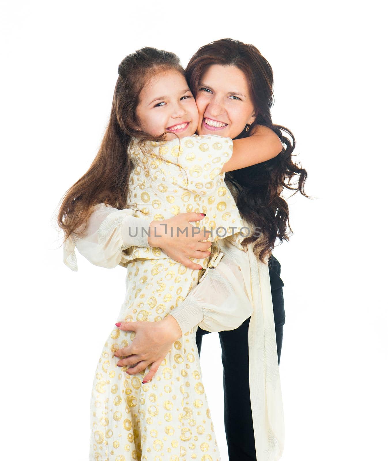 Cute little girl hugging her mother. Happy family.