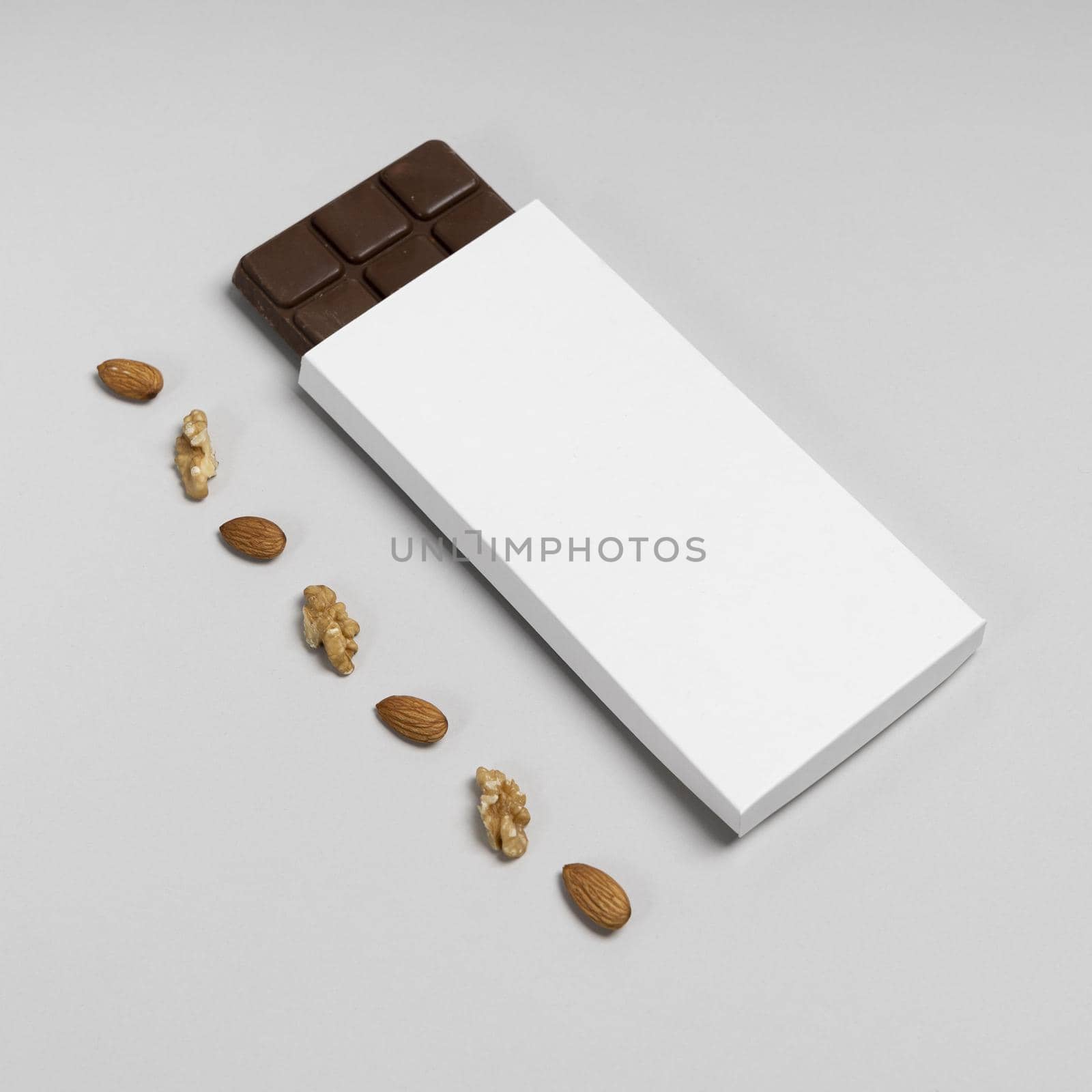 high angle blank chocolate bar package with nuts copy space by Zahard
