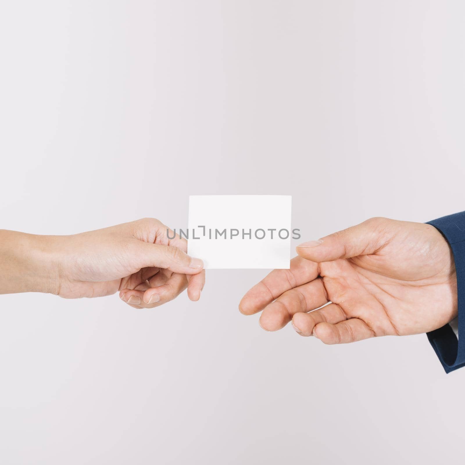 hands exchanging business card by Zahard