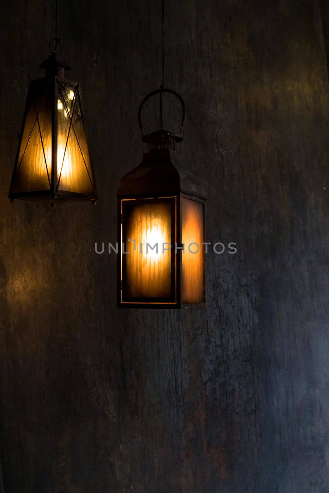 Lantern hang in front of wooden house in the night