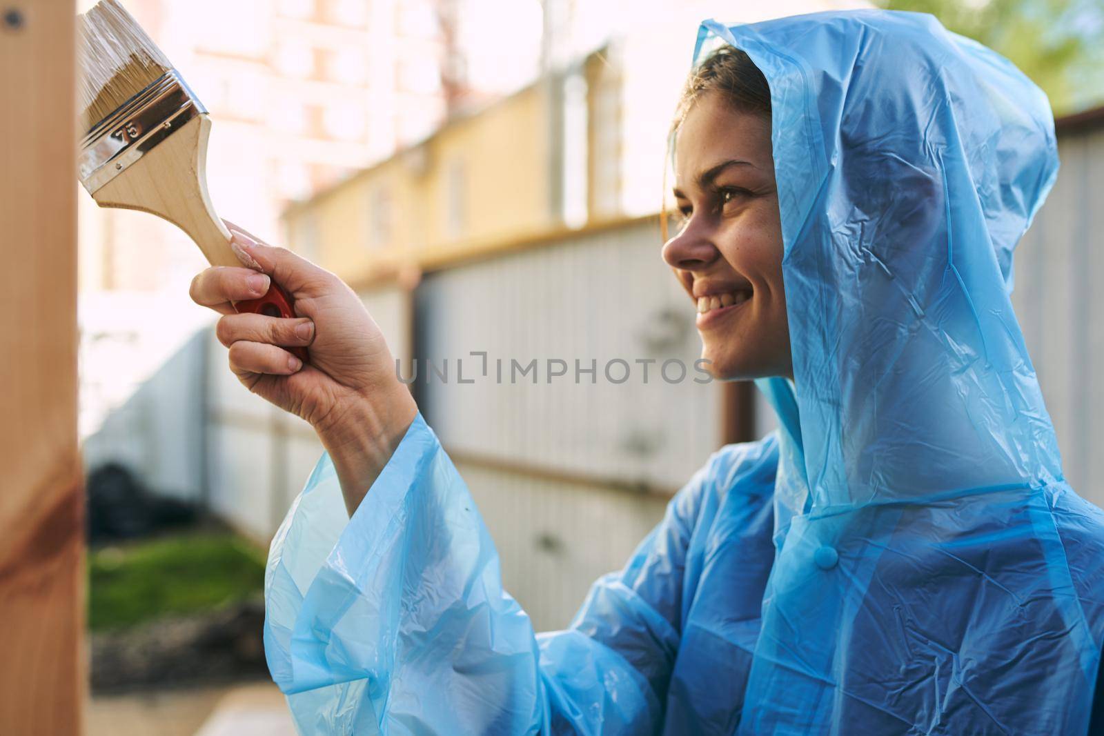 woman in protective suit painter accessories wooden object designer. High quality photo