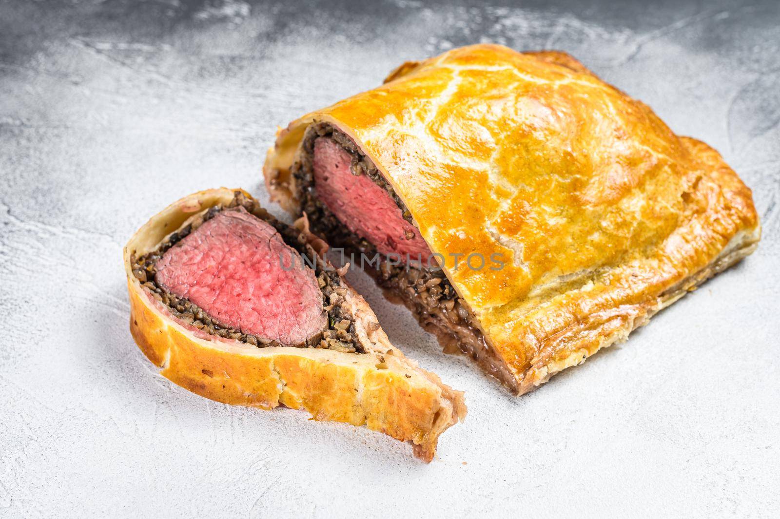 Beef Wellington puff pie classic steak dish with tenderloin meat. White background. Top view by Composter