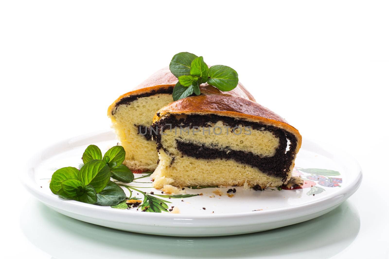 sweet pastries, roll with poppy seeds inside on a white background