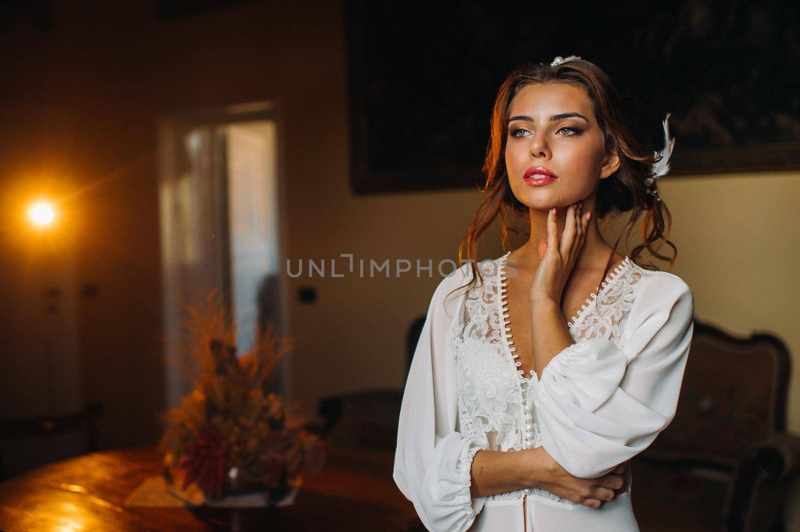 a bride in underwear and a white robe in the interior of a Villa in Italy at a wedding.morning of the bride in Tuscany.boudoir photo session at the Villa. by Lobachad