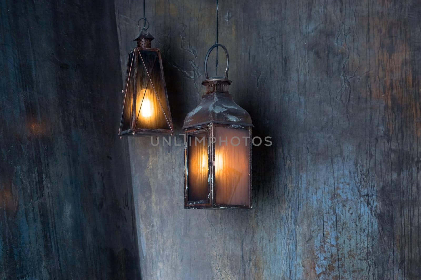 Lantern hang in front of wooden house in the night