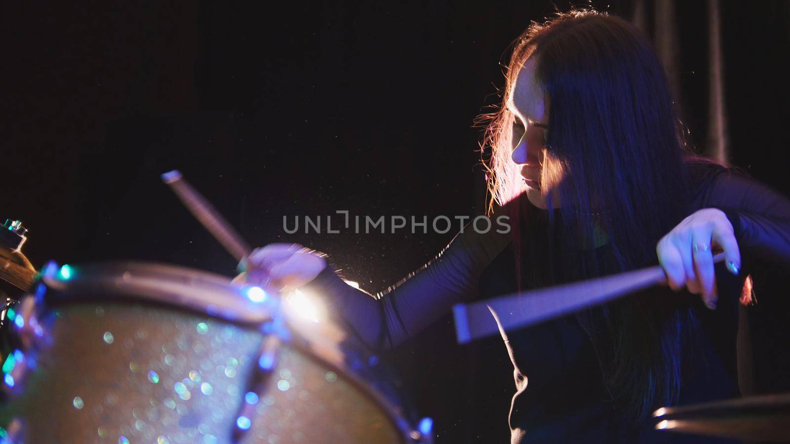 Passionate girl with long hair - percussion drummer perform music break down - teen rock music, telephoto