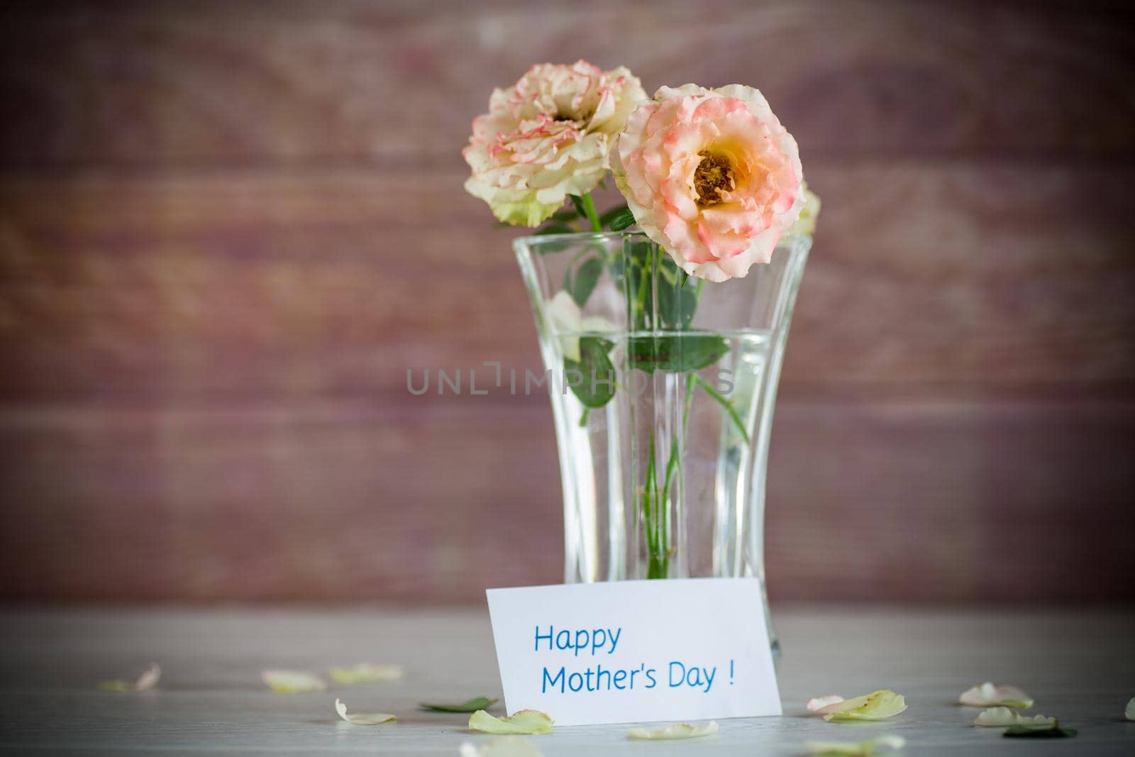 bouquet of beautiful roses on a wooden table