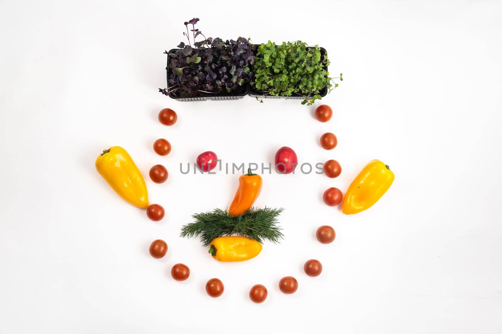 The face of a man made of sliced vegetables on a white background.