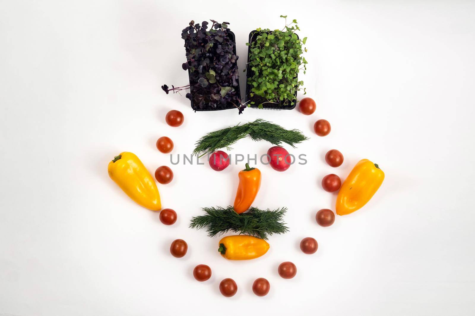 The face of a man made of sliced vegetables on a white background.