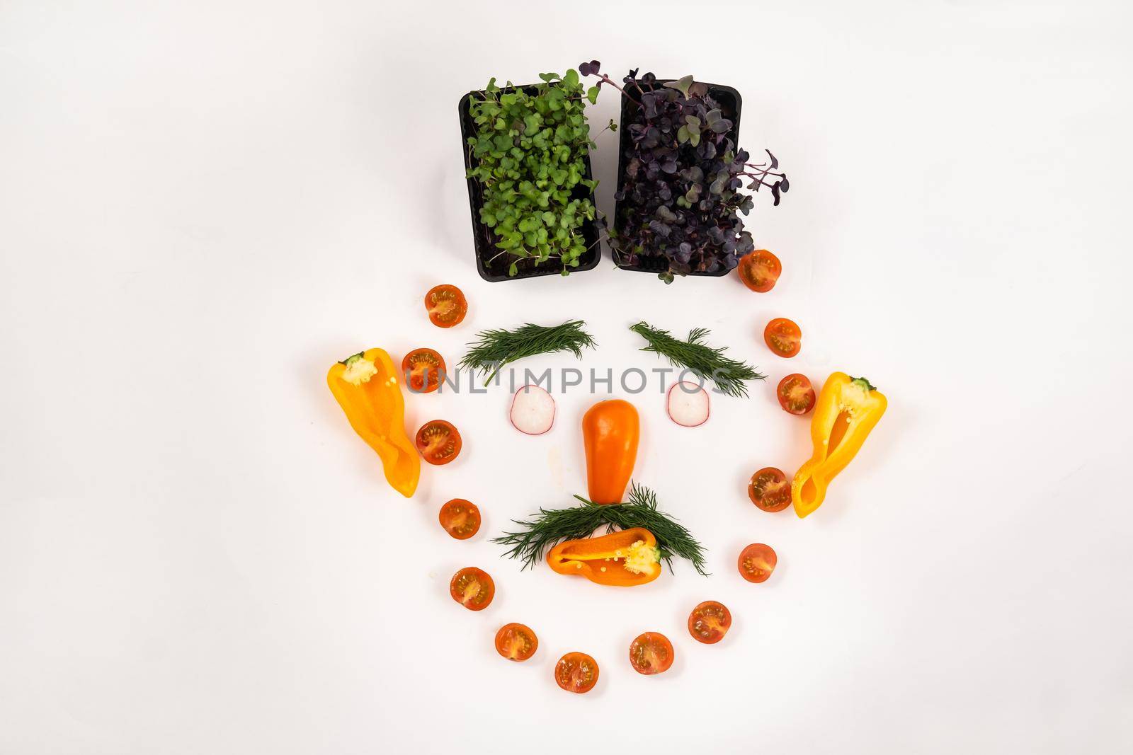 A person's face made of vegetables on a white background.