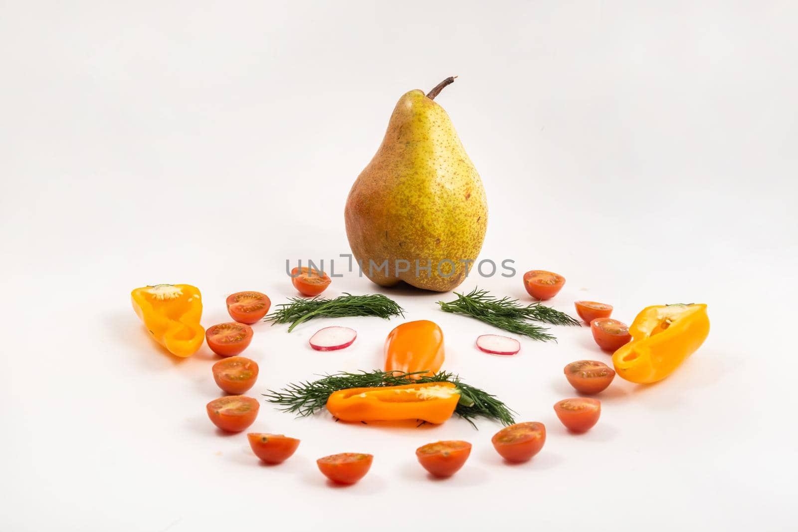 The face of a man made of sliced vegetables and a pear on his head on a white background.