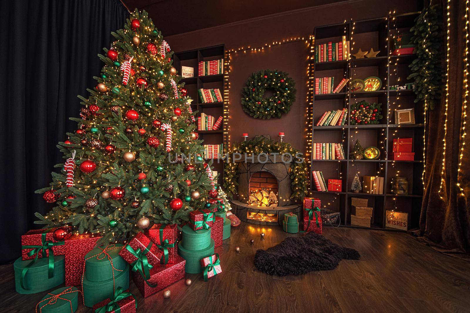 Stylish interior of room with beautiful Christmas fir tree and decorative fireplace by Studio_SOK