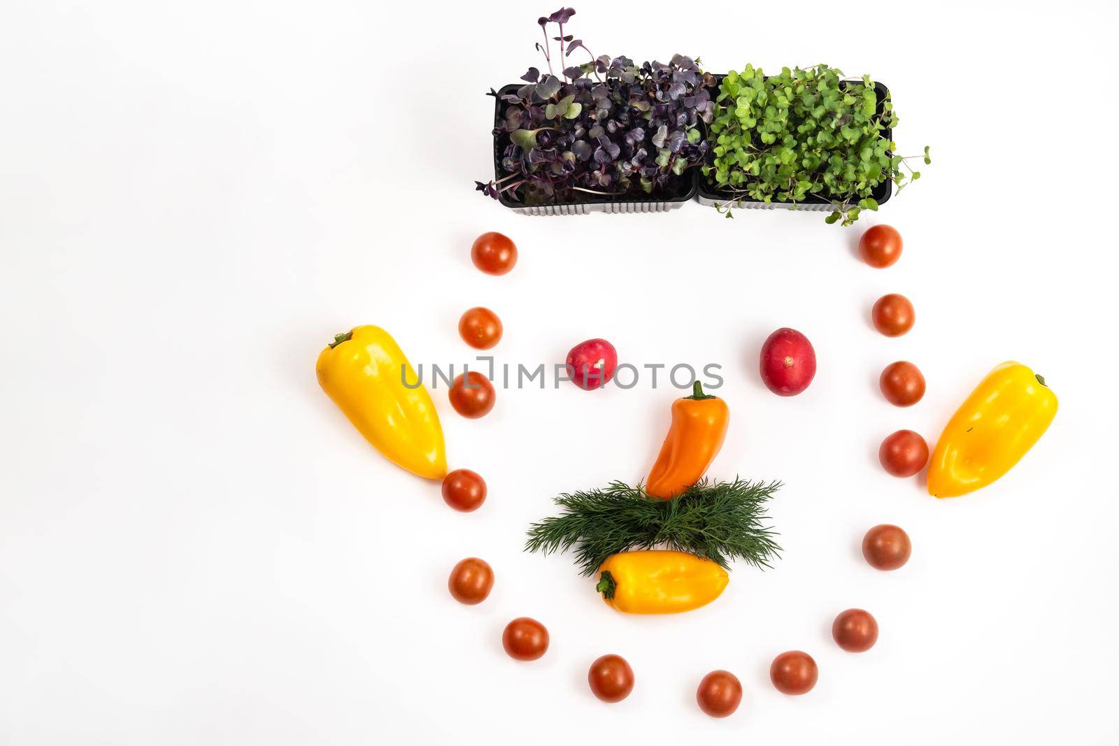 The face of a man made of sliced vegetables on a white background.