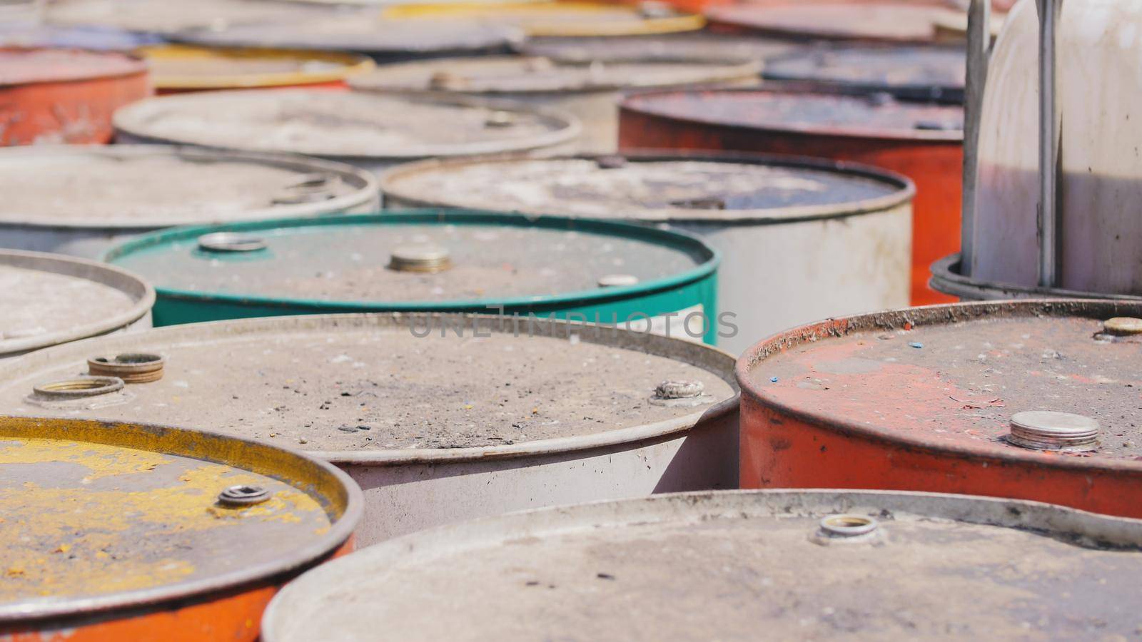 On the territory of the processing plant there are dirty barrels with the used oil