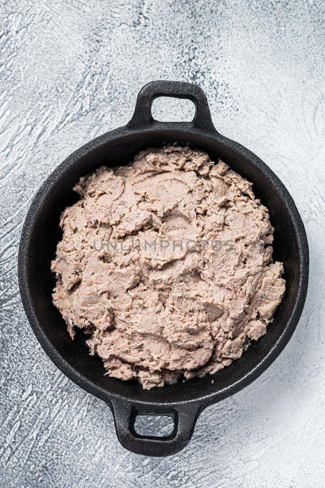 Duck pate Rillettes de Canard in a pan. White background. Top View. Copy space by Composter