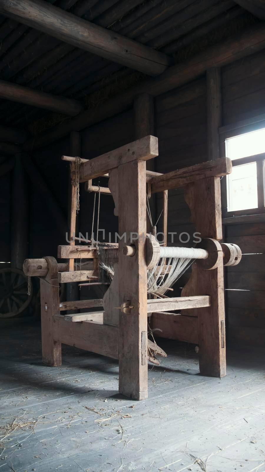 Old age wooden loom machine, vertical by Studia72