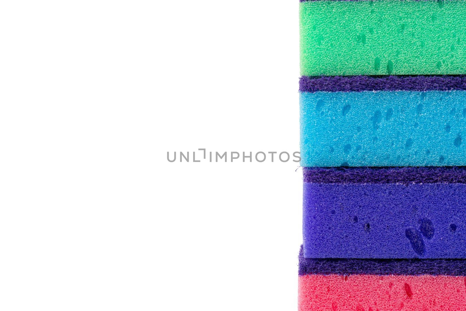 Stack of kitchen sponges isolated on white background, close up