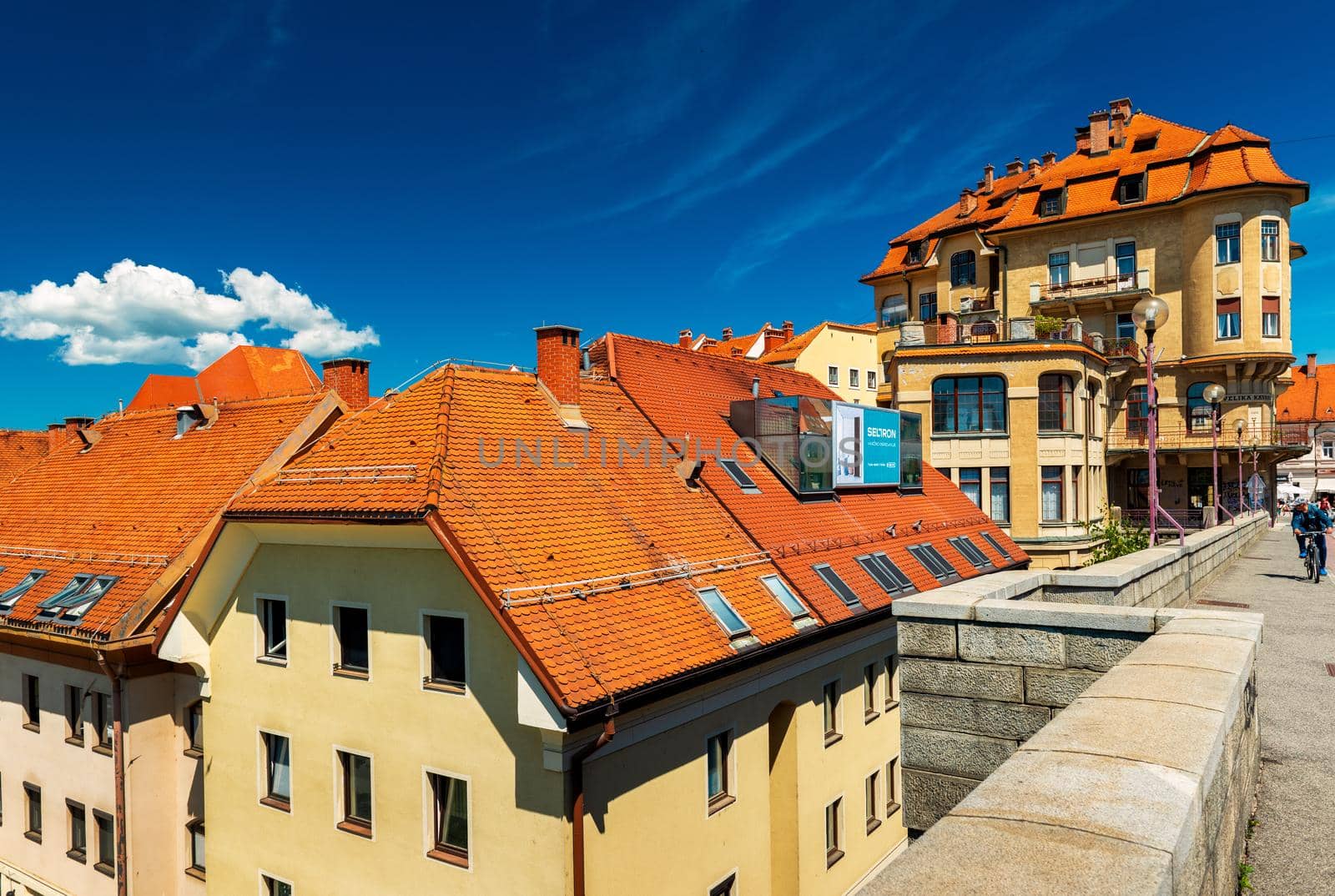 Maribor - June 2020, Slovenia: View from the Old Bridge (Glavni Most) on the old historical building with red roof tiles 