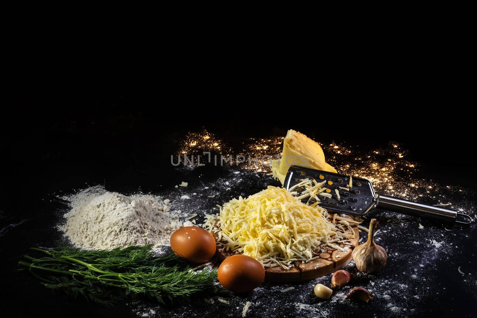 still life of the process of making cheese balls with garlic and dill on a black background by Lobachad