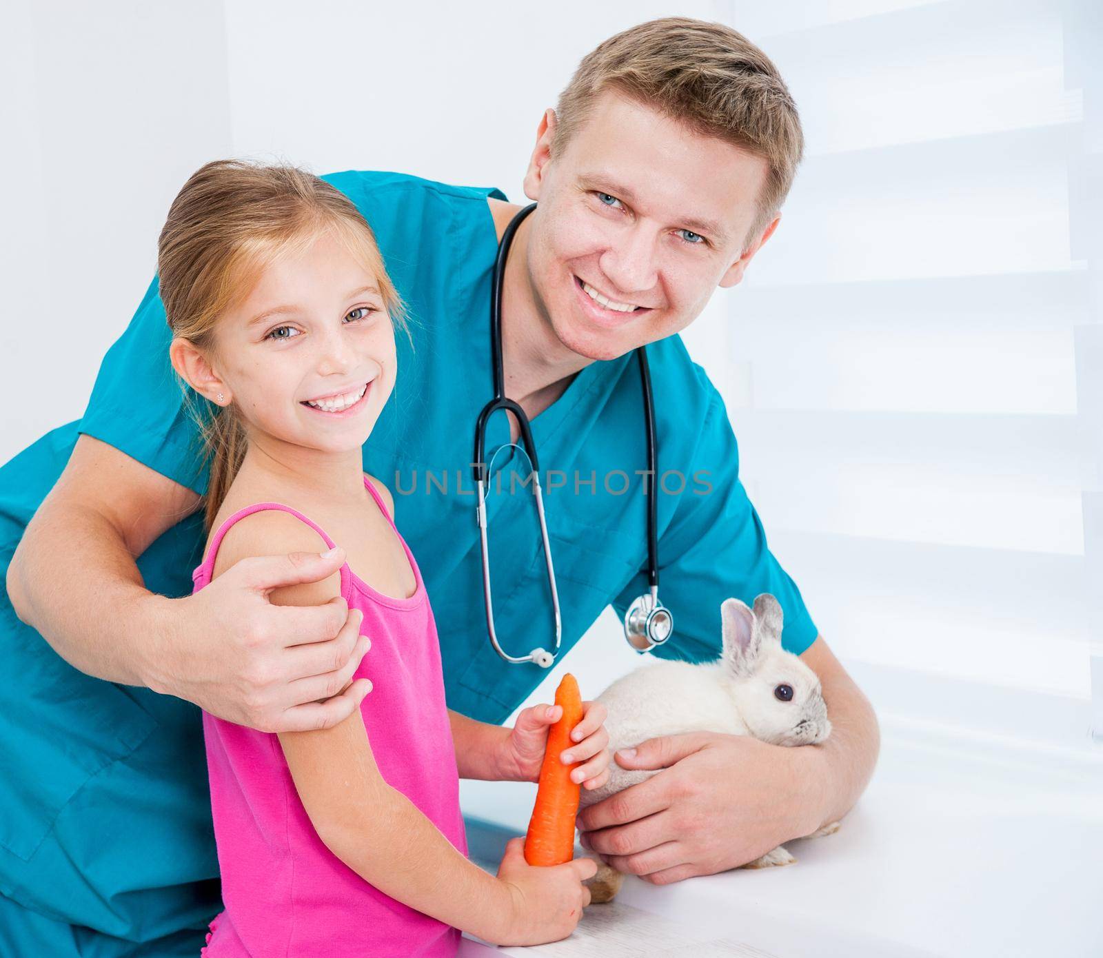 doctor of veterenarii and little girl with rabbit by tan4ikk1