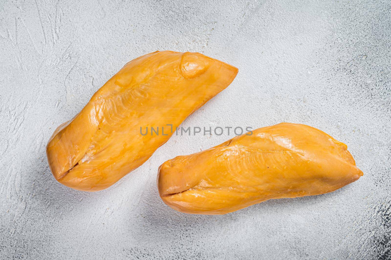 Smoked chicken breast fillet meat delicacy. White background. Top view by Composter