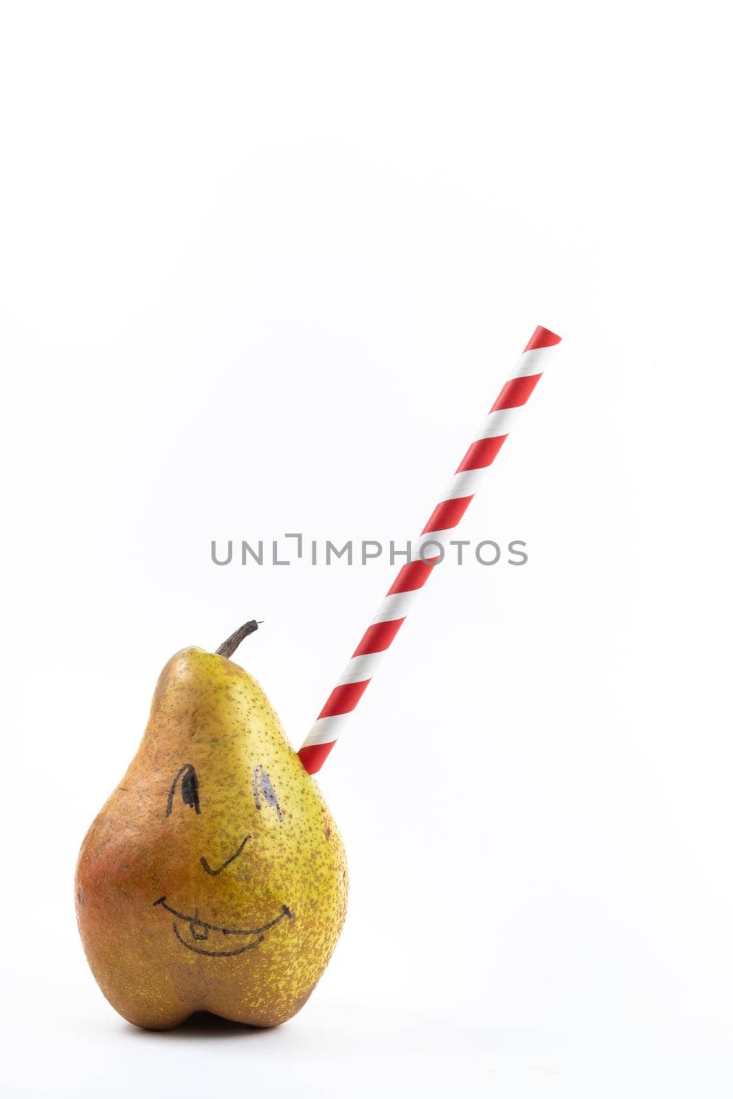 A large pear with a drinking tube sticking out of it on a white background.