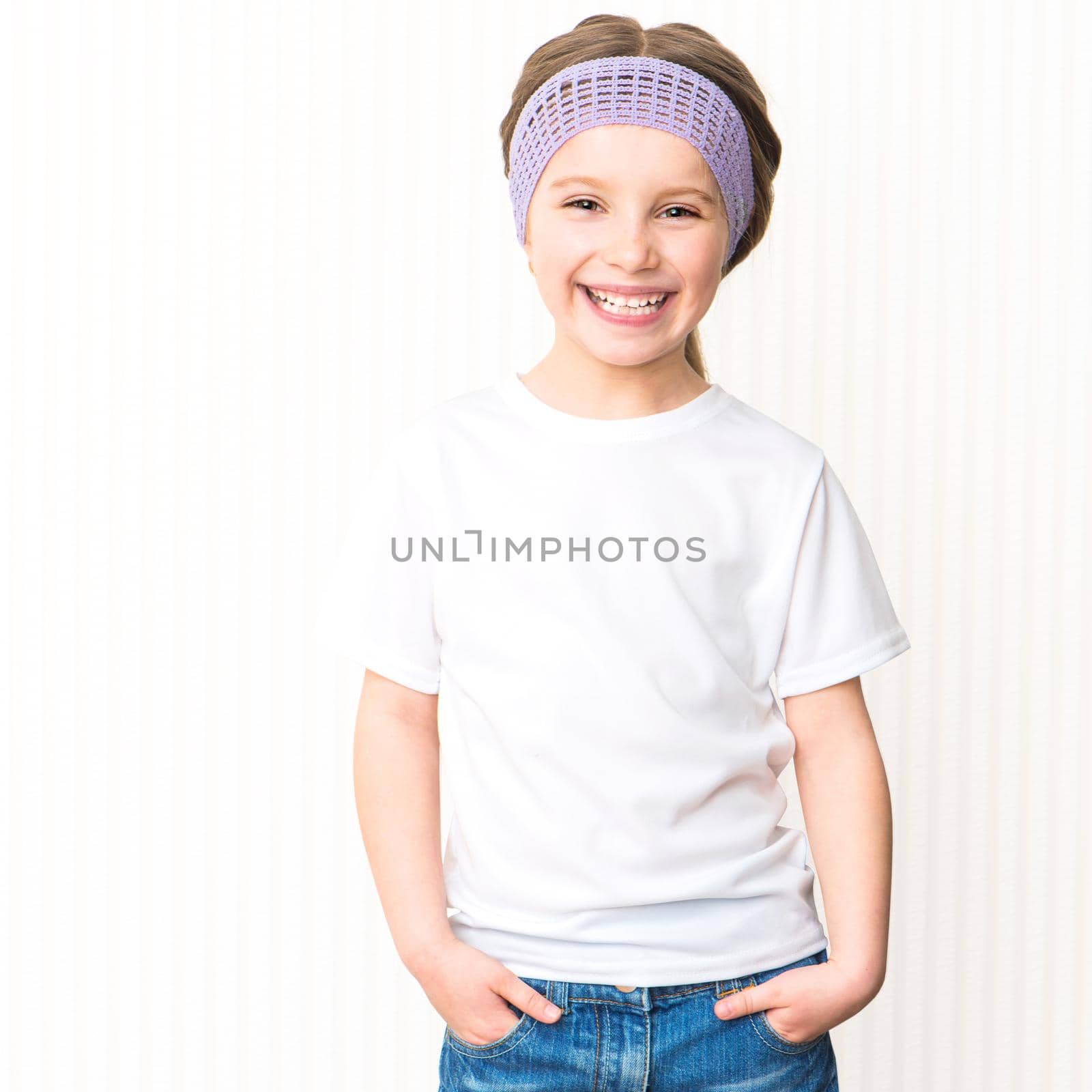 Cute smiling little girl in white t-shirt