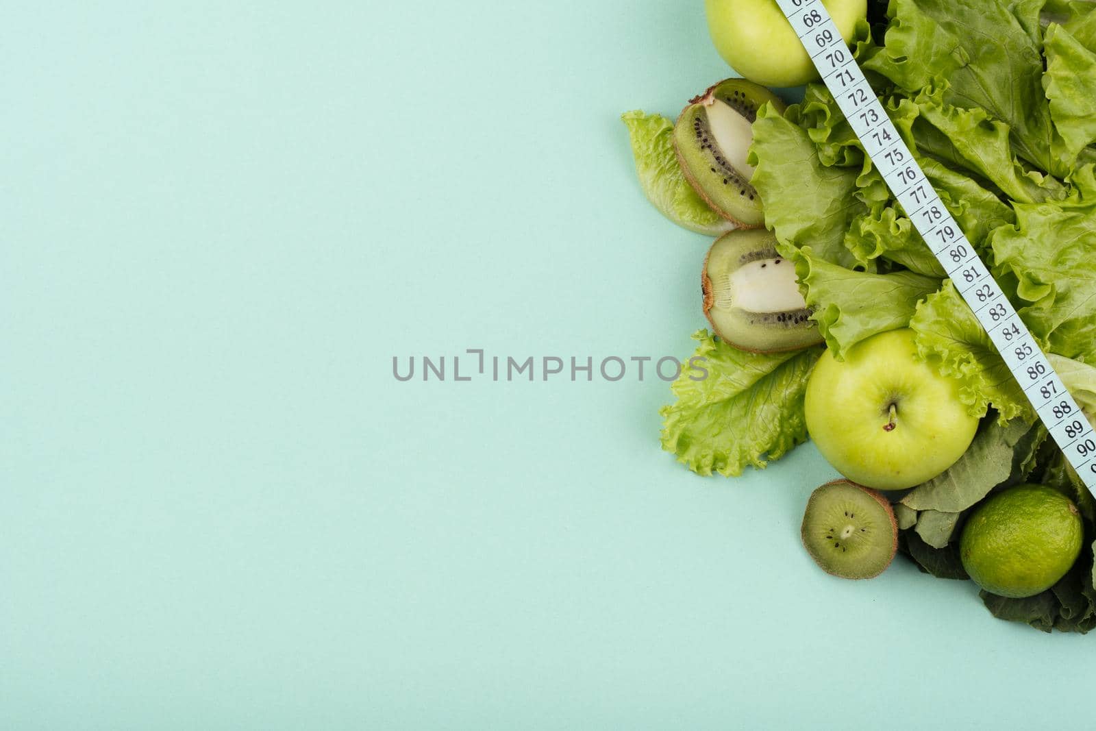 green fruit with measurement copy space by Zahard