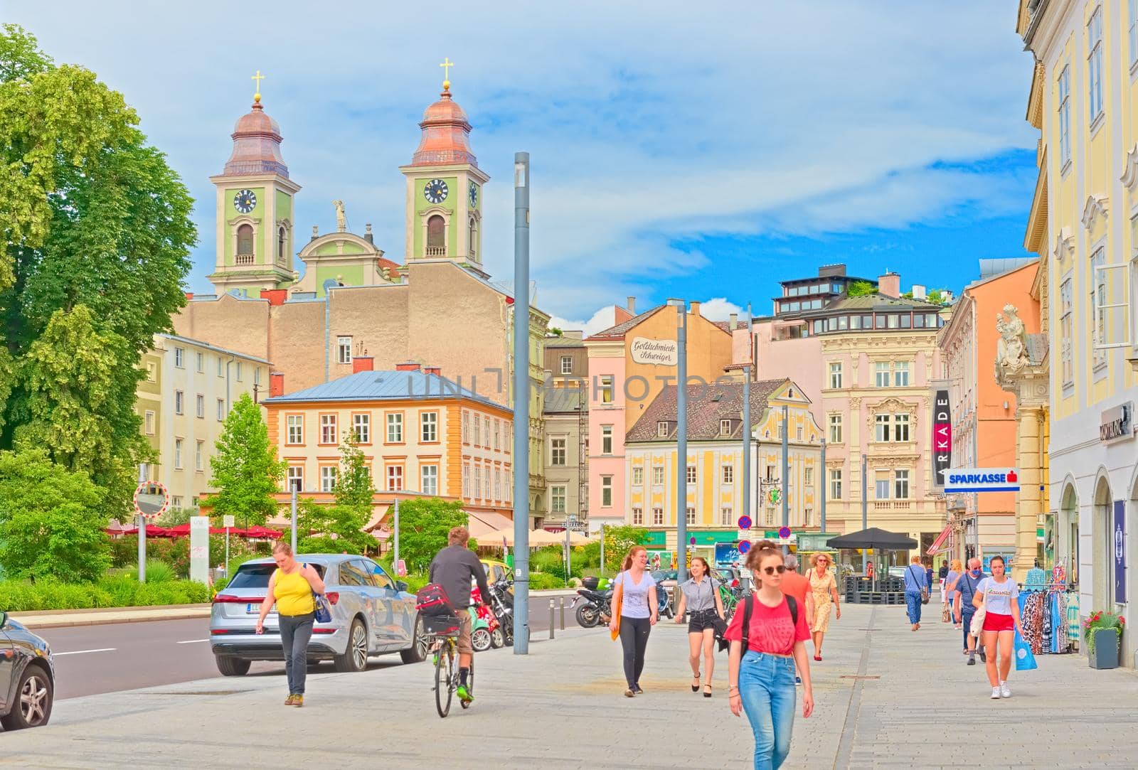 Linz - June 2020, Austria: View of Linz city center with people walking along colorful historical buildings