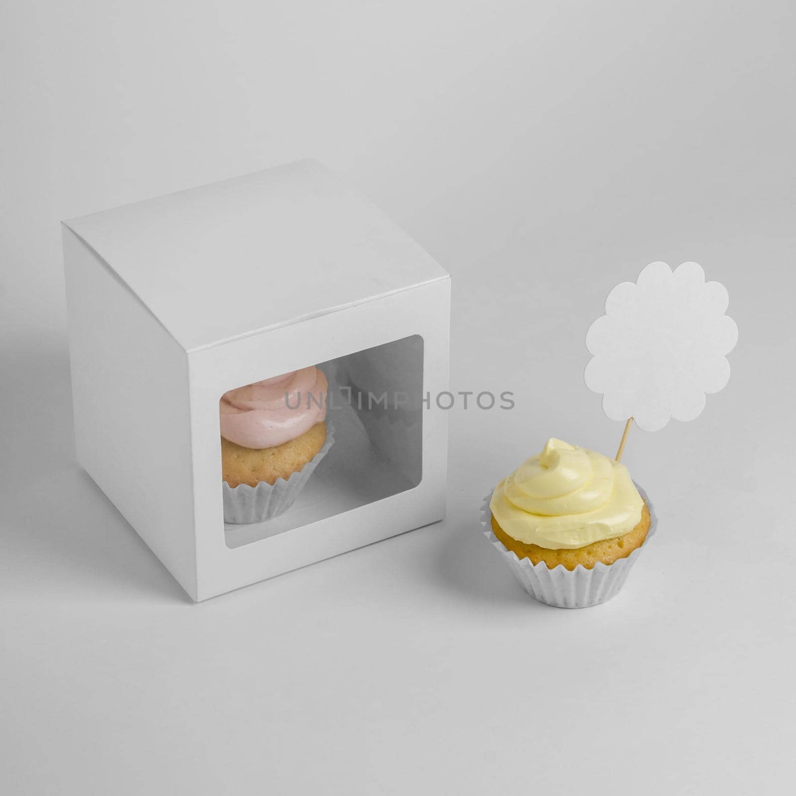 high angle two cupcakes with packaging box by Zahard