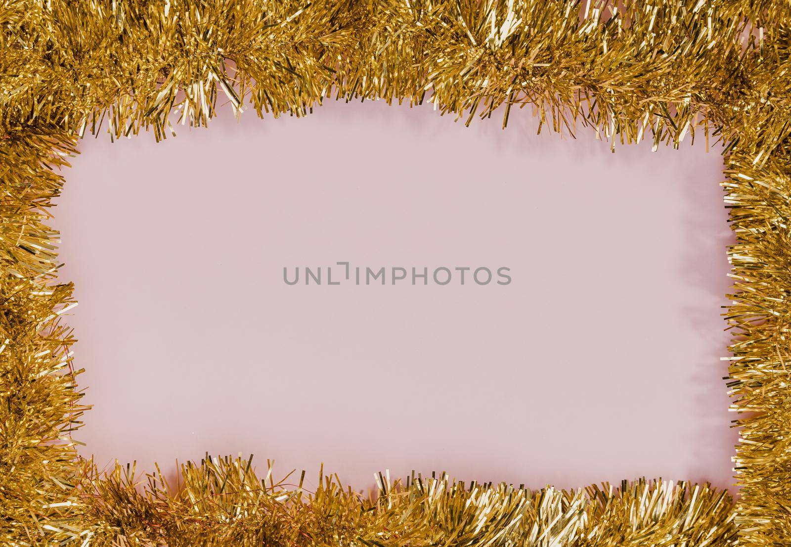 golden tinsel frame with pink background