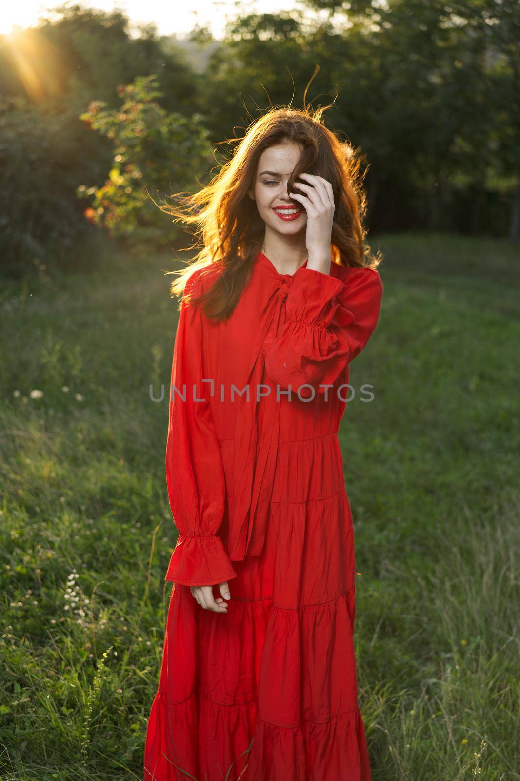 woman in red dress posing nature sun fun by Vichizh