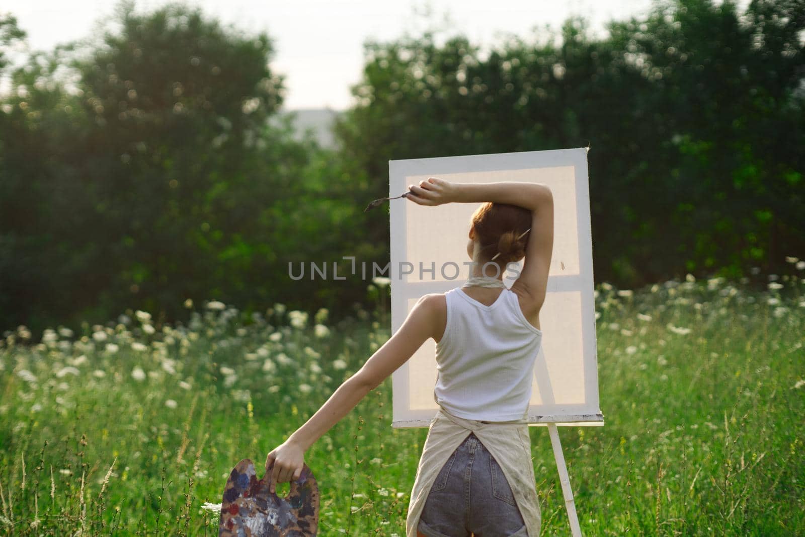 woman artist nature drawing art creative picnic. High quality photo