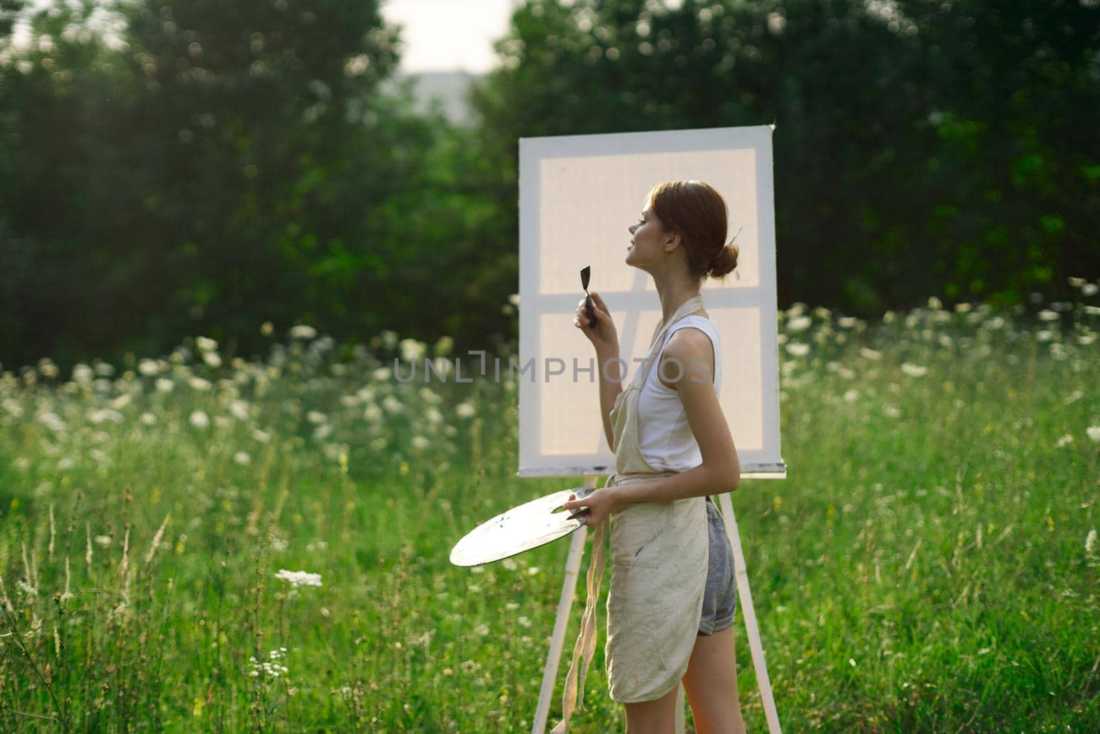 woman artist nature drawing art creative picnic. High quality photo