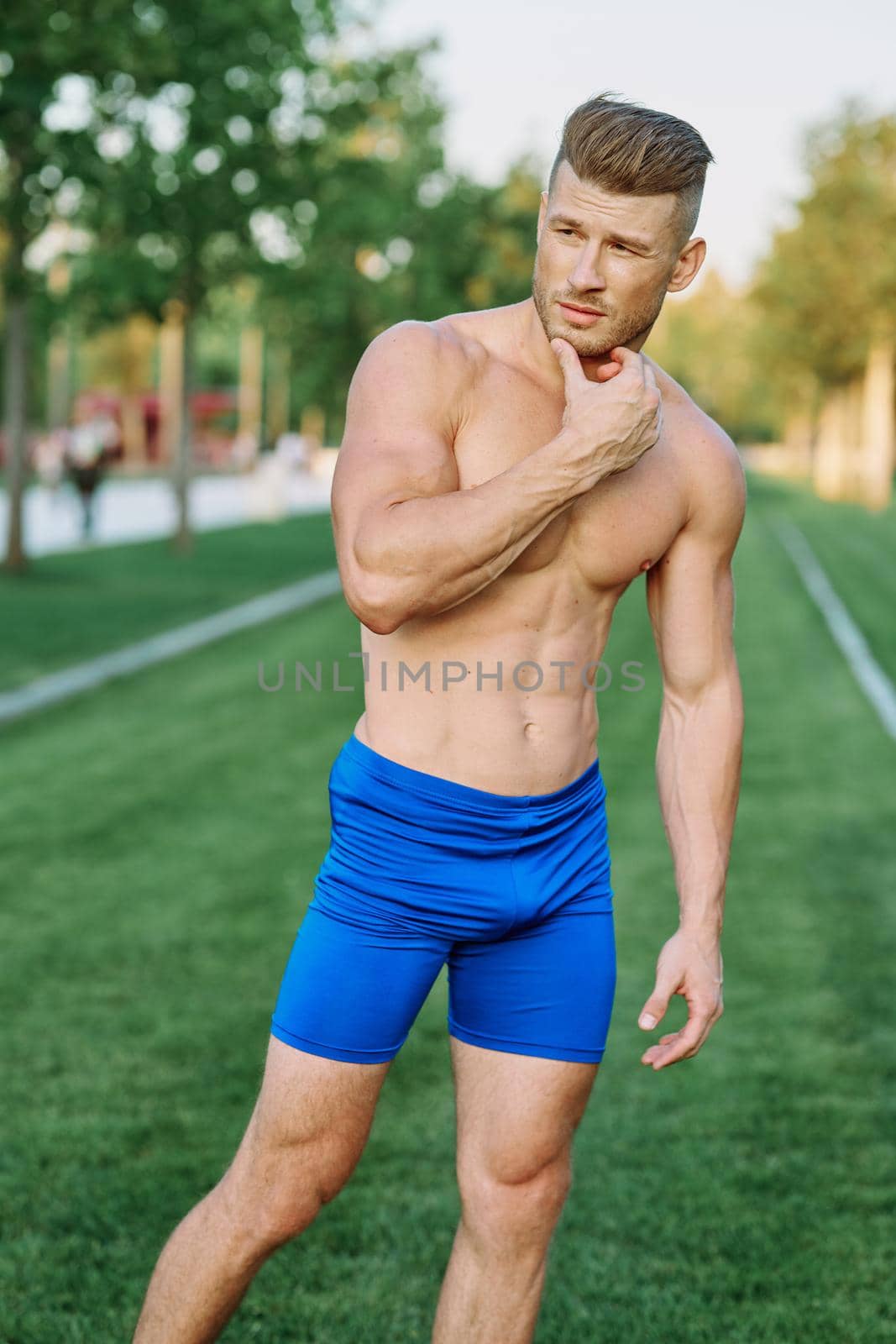 Muscled Man Doing Exercises Outdoor Fitness Summer by Vichizh