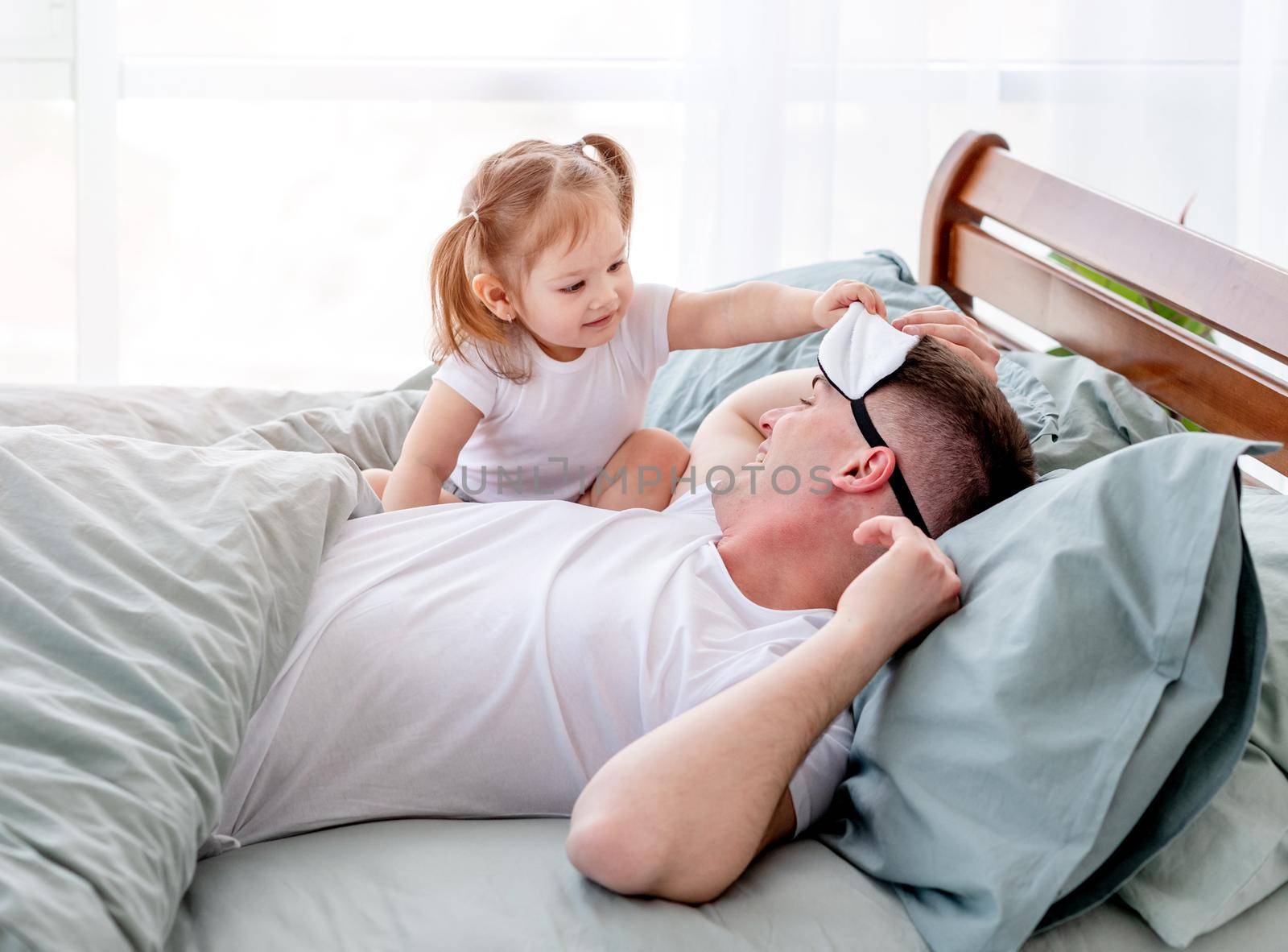 Father with daughter in the bed by tan4ikk1