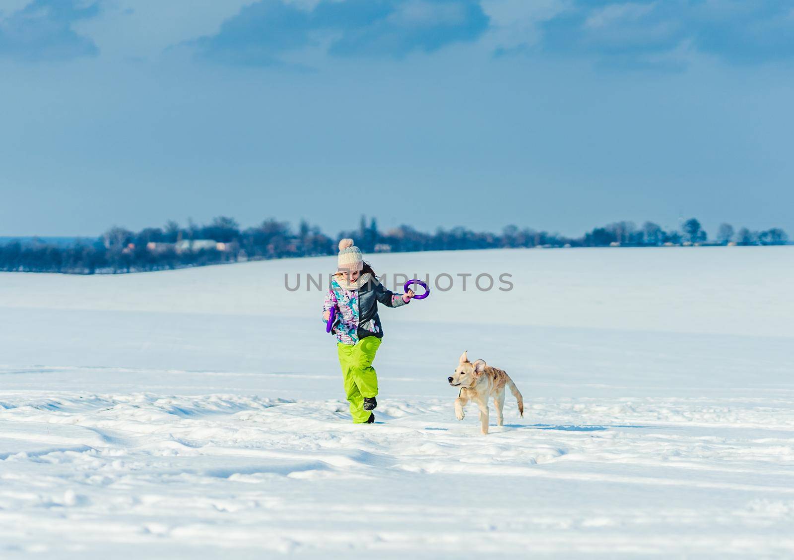Girl running with dog in snow by tan4ikk1