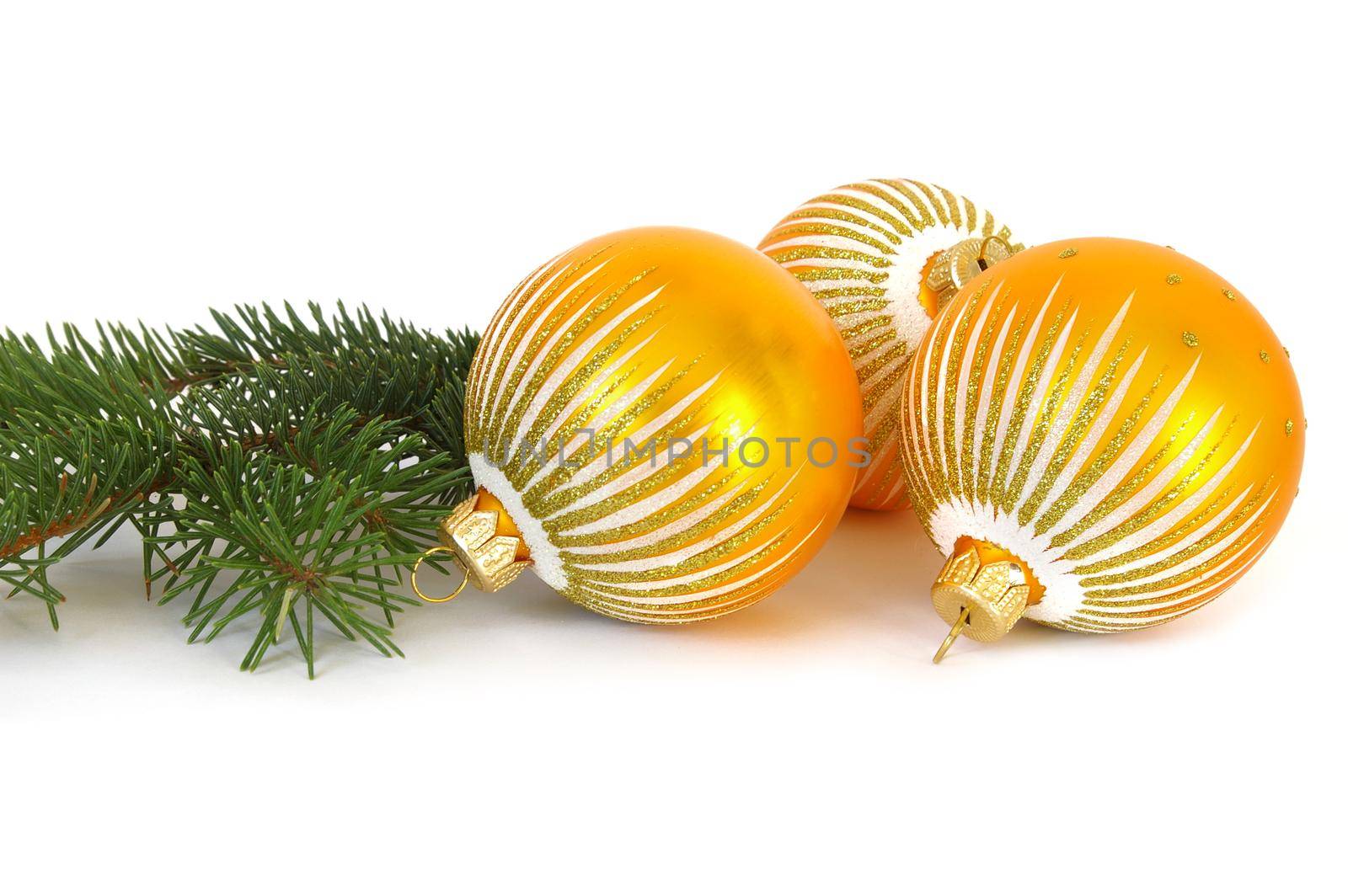 Three golden spheres and Christmas tree on a white background
