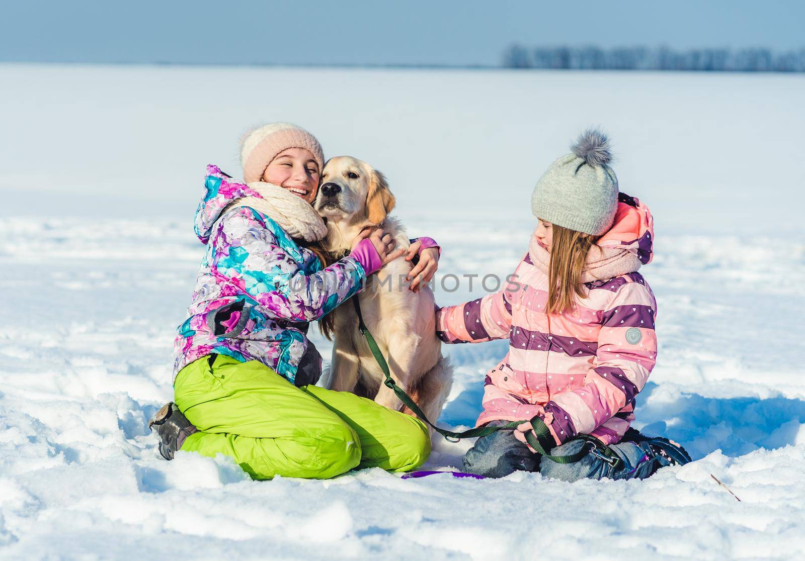 Girls with dog on winter walk by tan4ikk1