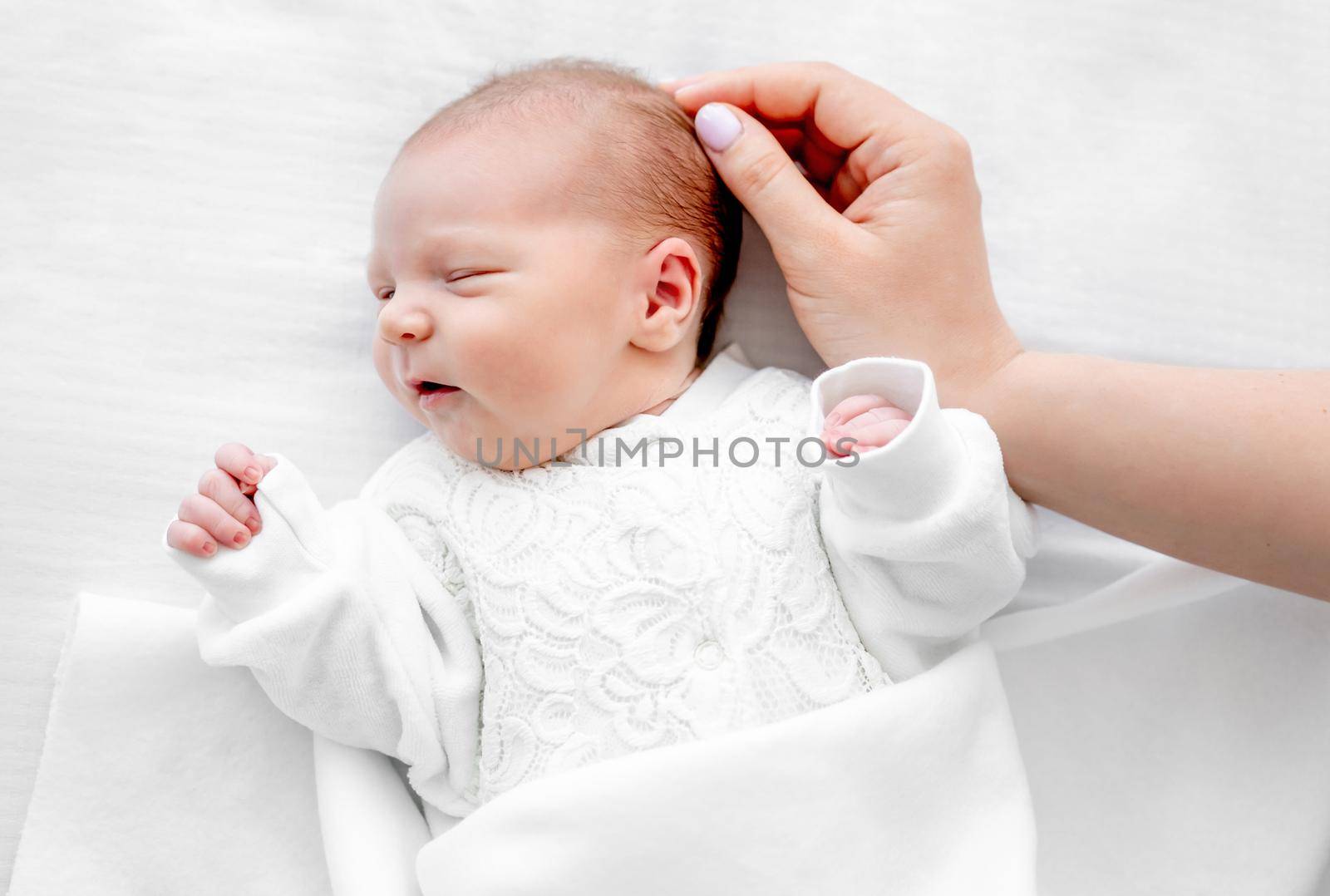Newborn baby and mother hand by tan4ikk1